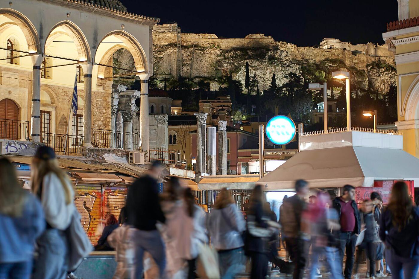 Monastiraki at night: crowds, lights and the Acropolis