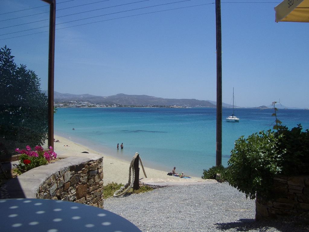 Lunch with a view: a seaside taverna table over Agios Georgios beach