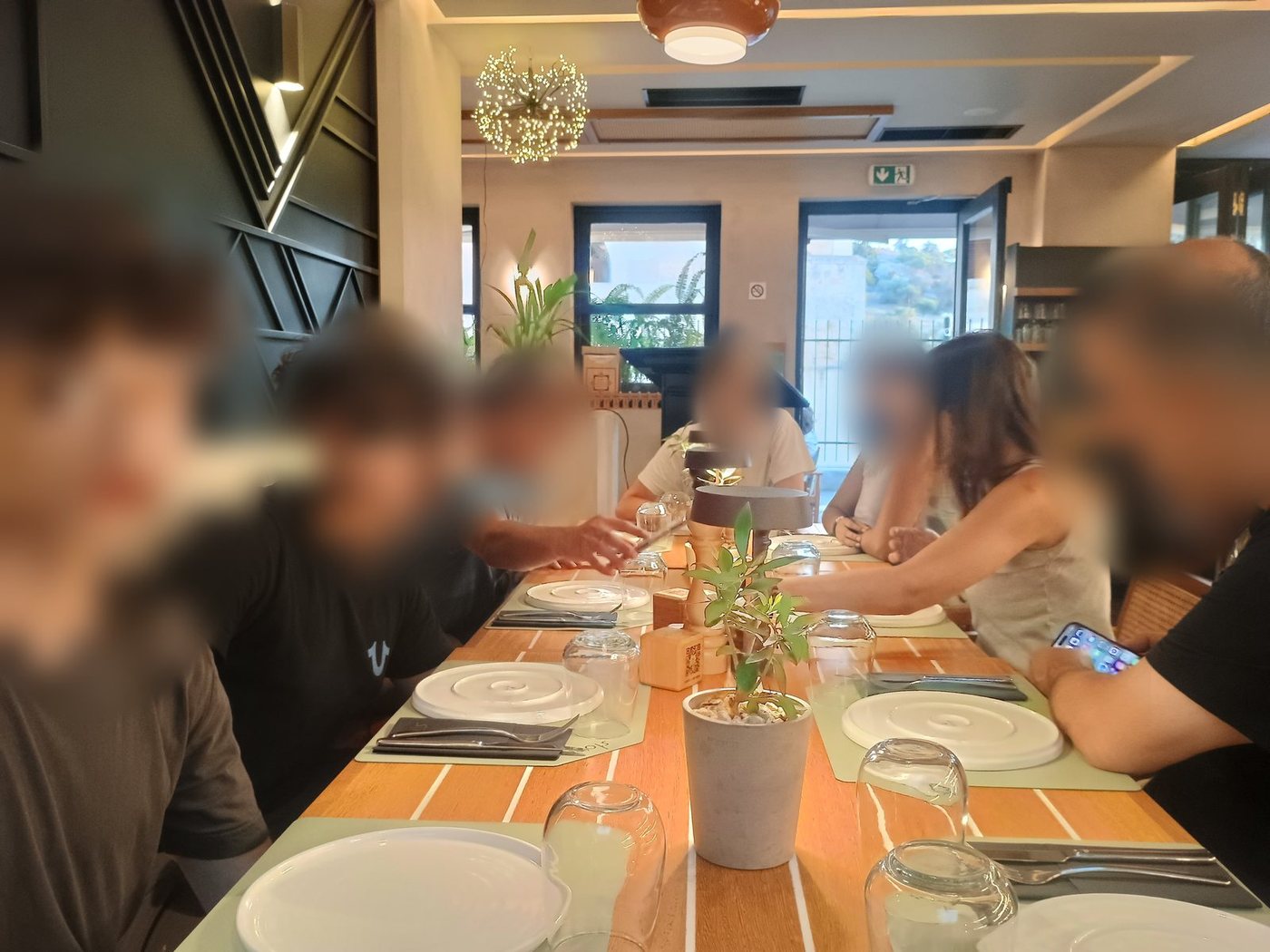 The whole group at the table for dinner, Athens