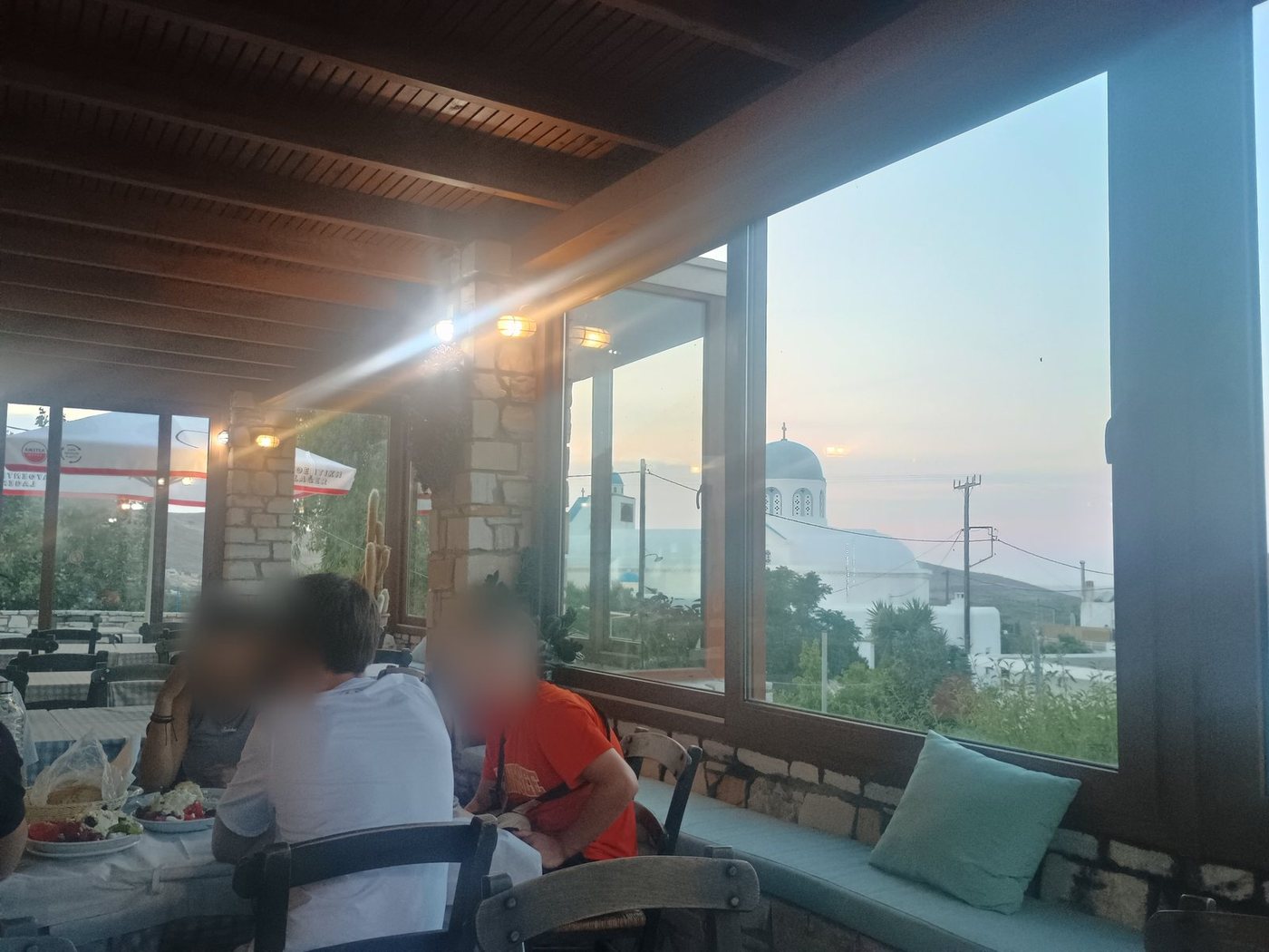 A taverna table by the window at sunset, Naxos
