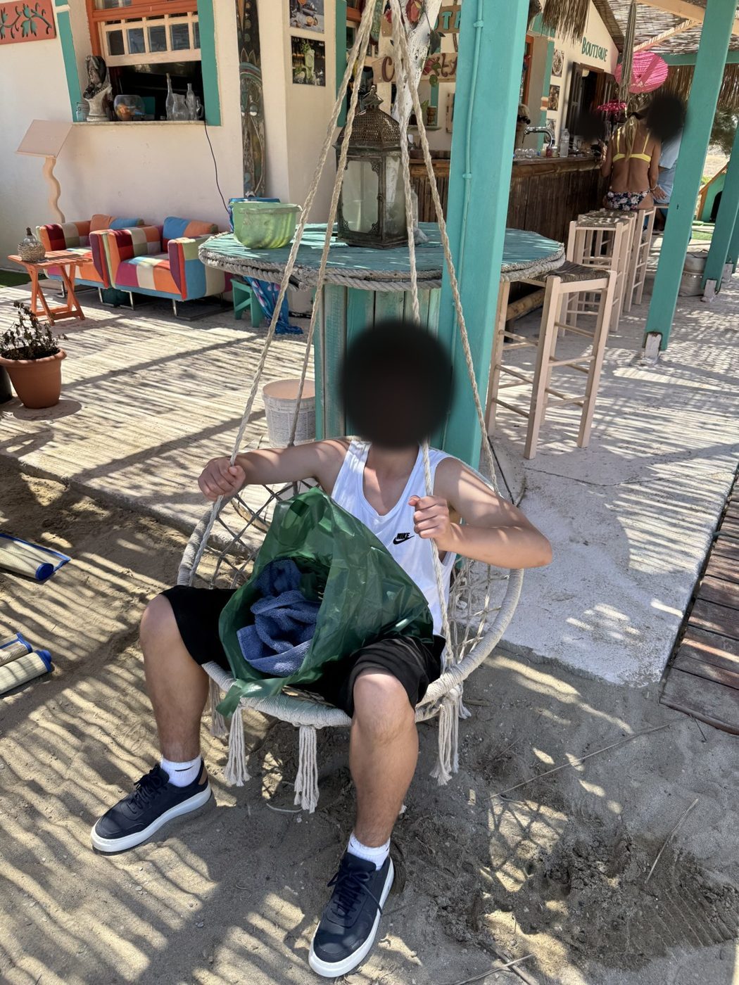 A hanging chair at the beach bar