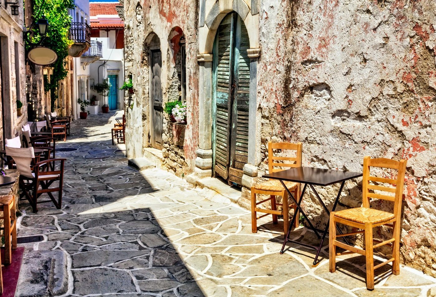 Café tables along a stone lane in Halki, the old capital of inland Naxos