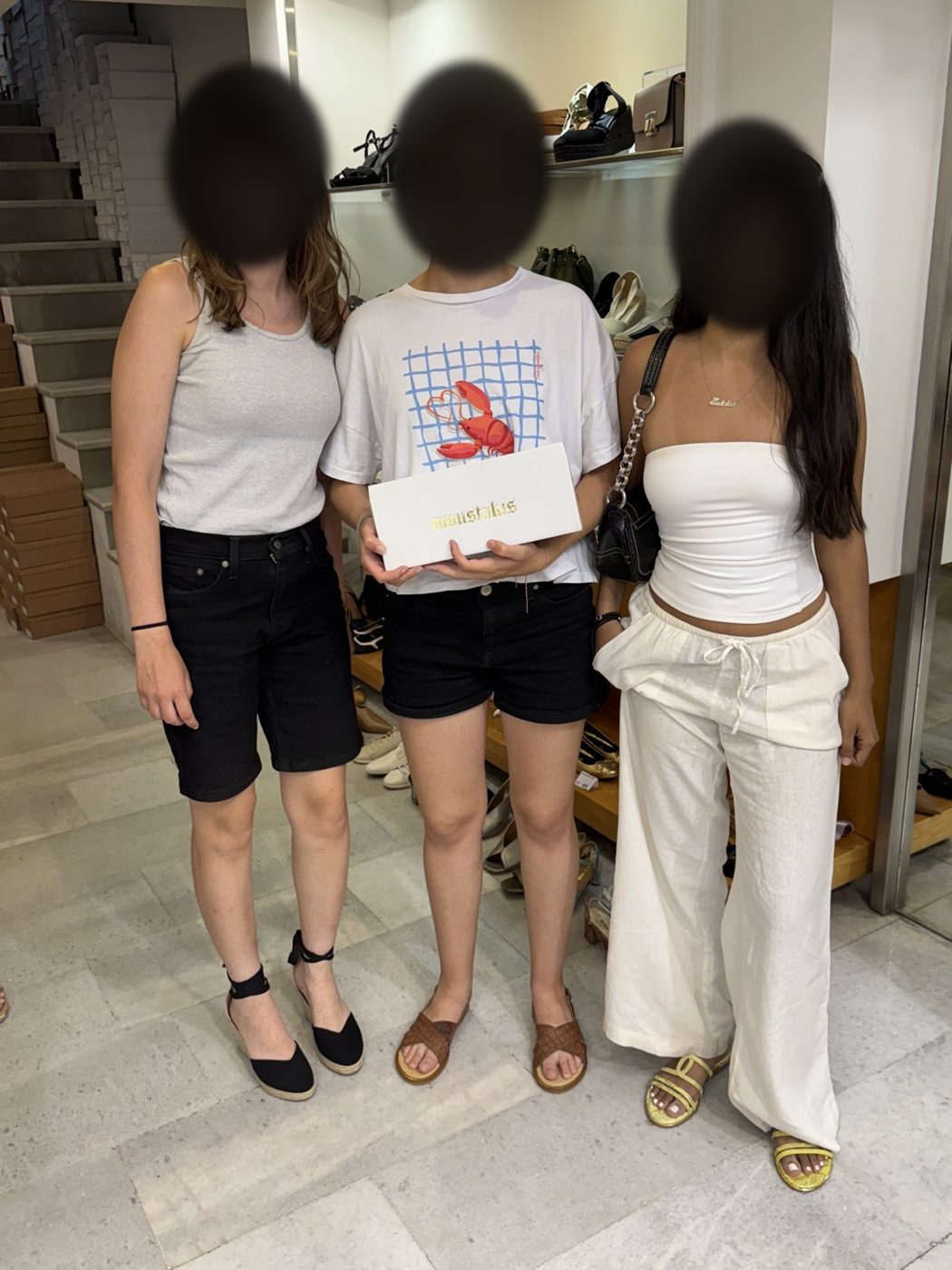 Shoe boxes in hand after a shopping stop